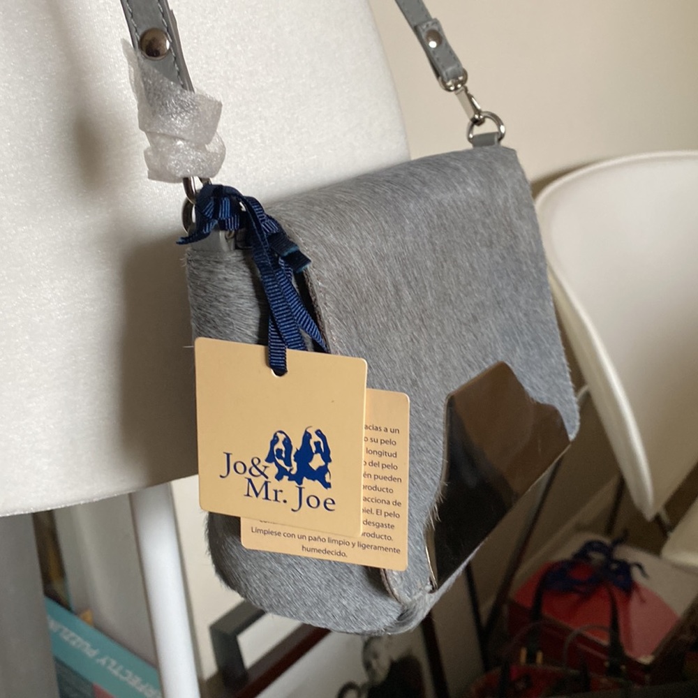Beautiful NWT cowhide and silver plated detail bag
